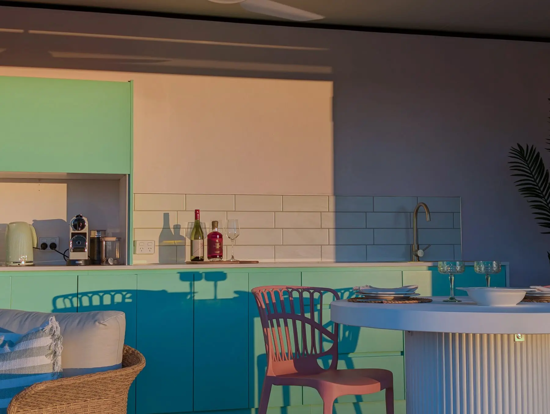 The pavilion kitchen bench at dusk, wine poured