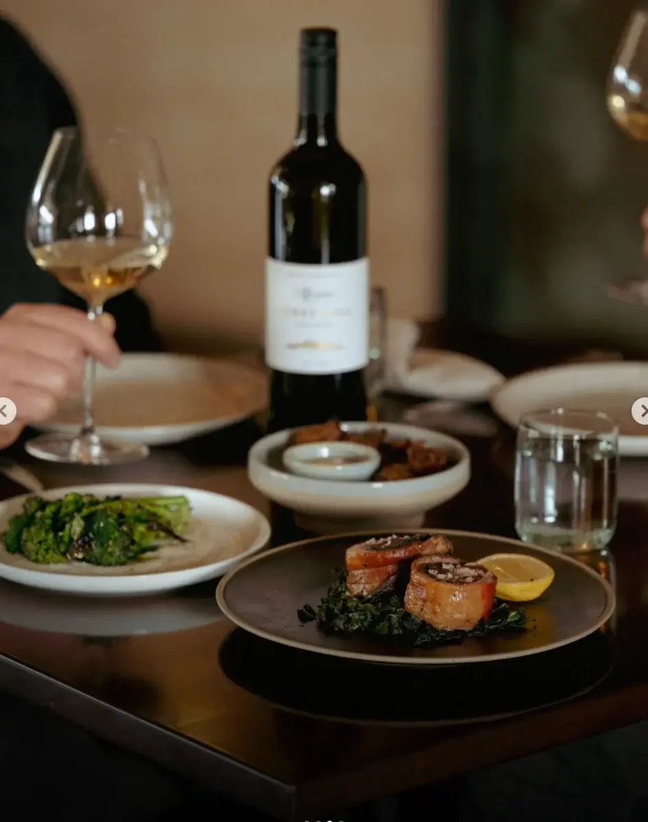 Wine and shared plates on the table at Margan Restaurant