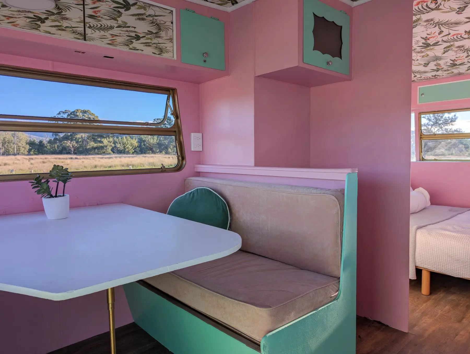 The dinette bench with the bed beyond